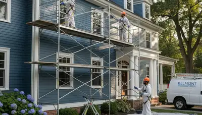 Professional painters in Newton, MA preparing a home exterior for painting